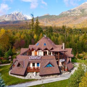 an overhead view of a large house in the mountains at Penzion Gabriel in Nový Smokovec