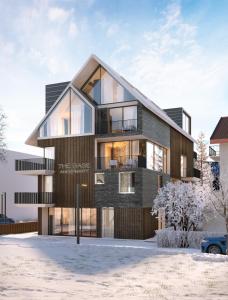 a rendering of a house in the snow at The Base Andermatt in Andermatt