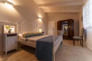 A bed or beds in a room at Agriturismo Ca' Poldo