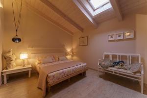 a bedroom with a bed and a skylight at Agriturismo Ca' Poldo in Ancona