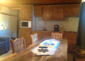 a kitchen with a table with a box on it at Appartement St Nicolas in Saint-Gervais-les-Bains +16 photos