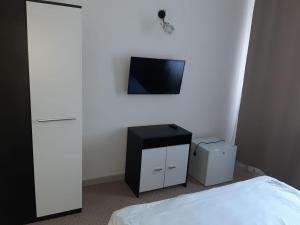 TV a/nebo společenská místnost v ubytování CASABLANCA