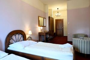 Postel nebo postele na pokoji v ubytování Hotel Bouček