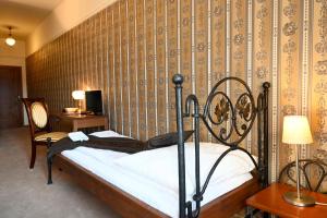 Postel nebo postele na pokoji v ubytování Hotel Bouček
