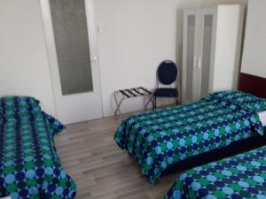Postel nebo postele na pokoji v ubytování Hotel Baan
