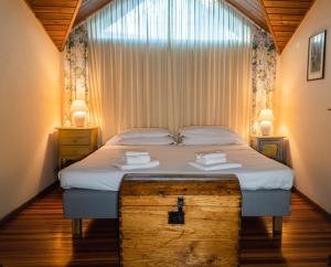 Tempat tidur dalam kamar di Agriturismo Relais "il Bricco"