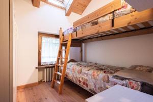 Posteľ alebo postele v izbe v ubytovaní Mansarda 4 posti letto in Villa a Borca di Cadore