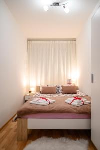 Posteľ alebo postele v izbe v ubytovaní Lumos Apartment