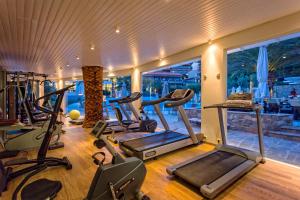 a gym with exercise equipment and a large window at Lagomandra Hotel and Spa in Lagomandra