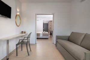 a living room with a couch and a table at Lagomandra Hotel and Spa in Lagomandra