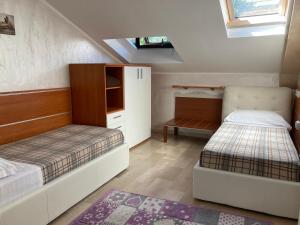 a bedroom with two beds and a tv on the ceiling at Oasis Lagoon Estate in Venice-Lido
