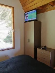 TV a/nebo společenská místnost v ubytování La Arboleda