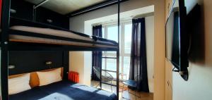 Кровать или кровати в номере Hostel Suffix
