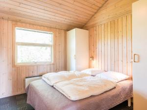 Ένα ή περισσότερα κρεβάτια σε δωμάτιο στο Serene Retreat in Henne By-By Traum