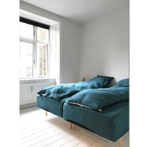 A bed or beds in a room at ApartmentInCopenhagen Apartment 1183
