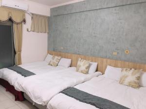 A bed or beds in a room at Chia Yun Homestay