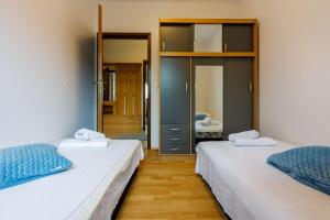 Posteľ alebo postele v izbe v ubytovaní Apartments ANITA