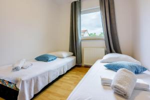 Posteľ alebo postele v izbe v ubytovaní Apartments ANITA