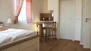 Postel nebo postele na pokoji v ubytování Apartmány Na Potoku