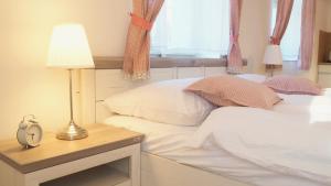 Postel nebo postele na pokoji v ubytování Apartmány Na Potoku