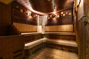 an empty sauna with wooden walls and wooden floors at Premier Hotel -CABIN- Obihiro in Obihiro