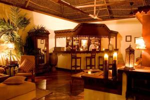 a living room with a bar in the center of a room at The Palms Zanzibar in Bwejuu