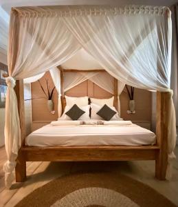 Voodi või voodid majutusasutuse Samura Maldives Guest House Thulusdhoo toas