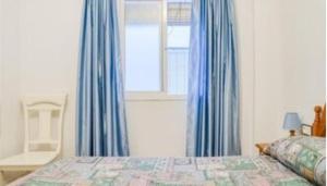 Postel nebo postele na pokoji v ubytování Apartamentos Los Arcos