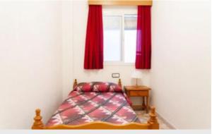 Postel nebo postele na pokoji v ubytování Apartamentos Los Arcos
