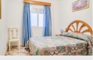 Postel nebo postele na pokoji v ubytování Apartamentos Los Arcos