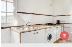 Kuchyň nebo kuchyňský kout v ubytování Apartamentos Los Arcos