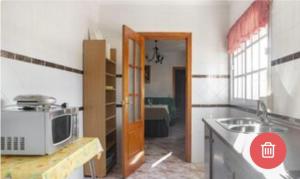Kuchyň nebo kuchyňský kout v ubytování Apartamentos Los Arcos