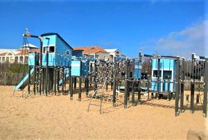 an empty playground in the sand on the beach at Appart Bréti Plage 1 avec parking - 50m de la plage in Bretignolles-sur-Mer