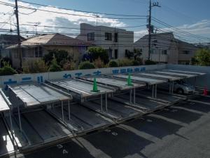 a group of metal trailers parked in a parking lot at Hotel Route-Inn Tokyo Asagaya in Tokyo