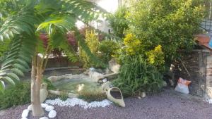 A garden outside B&B La Corte Dei Samidagi