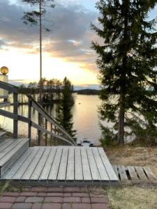 a wooden dock with a view of a lake at VITA Ruokolahti 3 in Ruokolahti