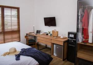 A bed or beds in a room at Rumanami Residence