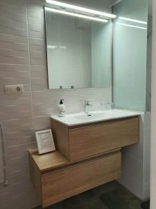 a bathroom with a sink and a mirror at Casa Los Dos in Cómpeta