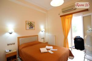 Postel nebo postele na pokoji v ubytování Apollon Hotel + 19 fotografií