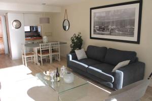 a living room with a couch and a table at San Alfonso del Mar, Departamento 2D+2B, Kayak in Algarrobo