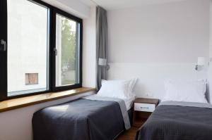 Tip Tap Guest House tesisinde bir odada yatak veya yataklar