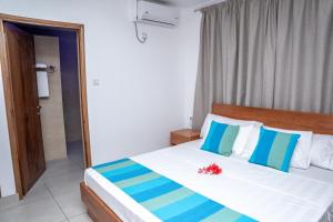 Postel nebo postele na pokoji v ubytování Kolibri Holiday Apartments
