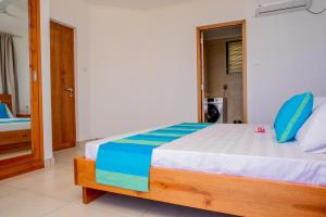 Postel nebo postele na pokoji v ubytování Kolibri Holiday Apartments