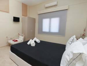 Posteľ alebo postele v izbe v ubytovaní Chrysiida Apartment