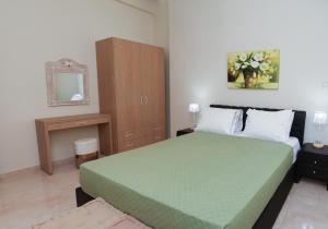 Posteľ alebo postele v izbe v ubytovaní Chrysiida Apartment