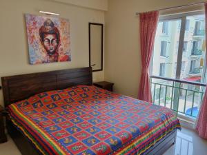 เตียงในห้องที่ Areia De Goa Luxury Condo