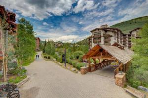 a bridge over a street in a town with buildings at Taylor's Crossing #210 condo in Copper Mountain