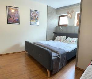 a bedroom with a bed and a mirror at Winterberger Lodge in Winterberg