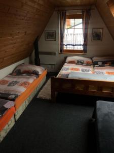 Postel nebo postele na pokoji v ubytování Penzion U Štěpána