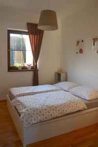 Uma cama ou camas num quarto em Apartmán Efka
